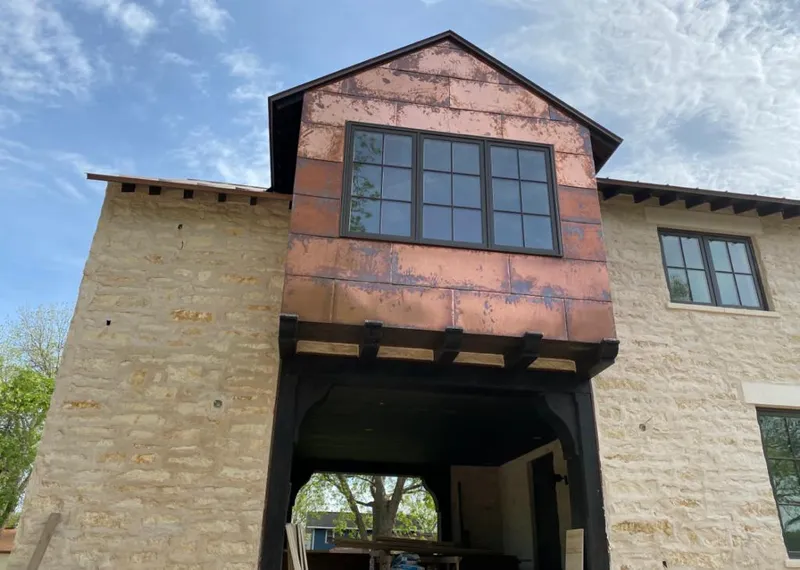 Copper metal panel facade on a stone building for Skylight Installation in Rocky Hill