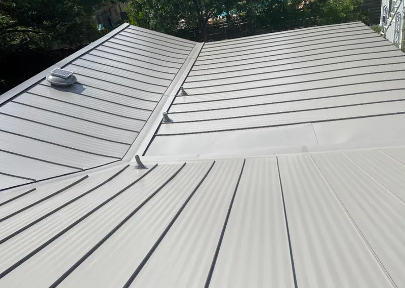 Solar attic fan installed on a metal roof for Roof Ventilation in Rocky Hill